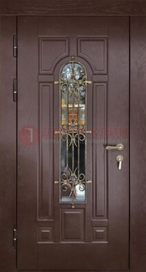 Темная железная дверь со стеклом и ковкой для частного дома ДСК-156 в Электростали